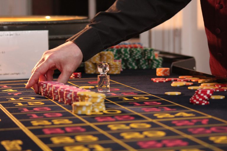 dealer sorting chips for a table game